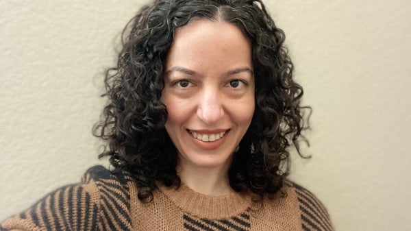 Portrait photo of Alaleh Moslehpour standing against a white background