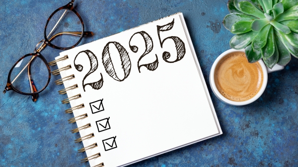 Photo illustration of a notepad checklist for 2025 with classes and a cup of coffee next to it