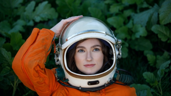 Emily Karlzen wearing a space helmet