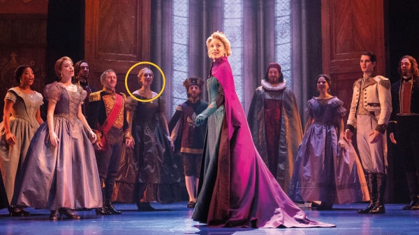 Woman in cast ensemble of Frozen on stage