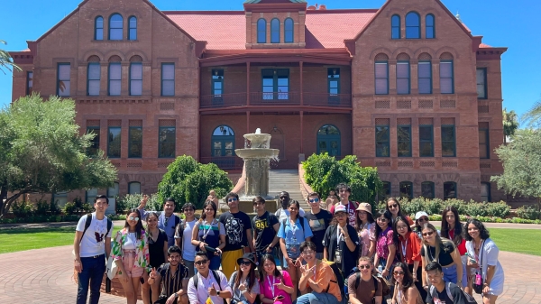 A group of International Students from the ASU-Cintana Sustainability and Innovation Summer Immersion Program pose in front of Old Main.