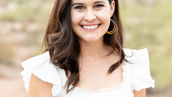 Portrait of Hailey Alcaraz Hershkowitz wearing a white shirt in an outdoor setting.