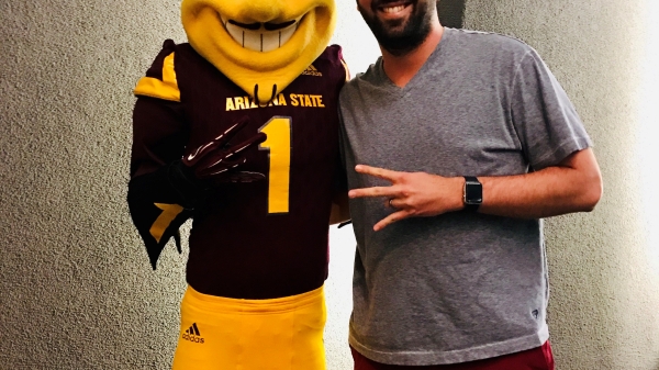 Graduating ASU student Anthony Celaya poses with Sparky the Sun Devil / Courtesy photo