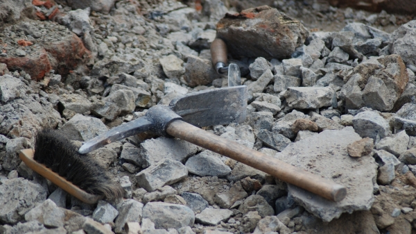 photo of archaeology tools (pick and brush)