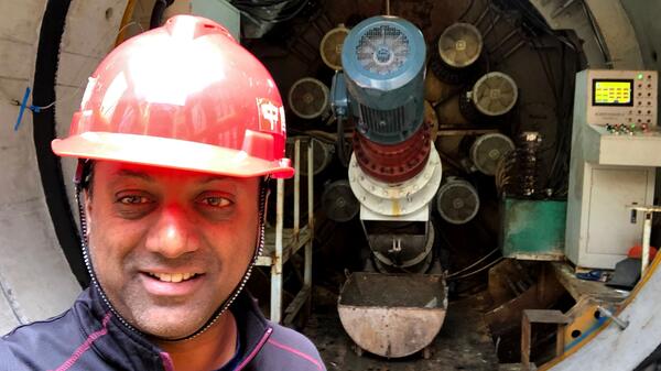 ASU Professor Samuel Ariaratnam snaps a selfie while working on pipeline construction