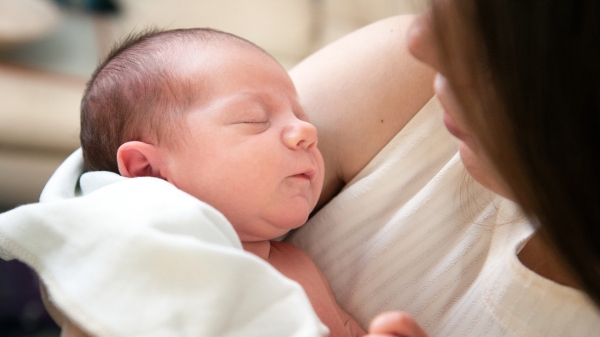 mother holding baby