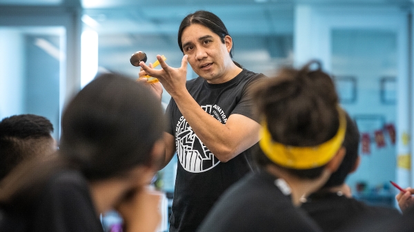 Native American man teaching students