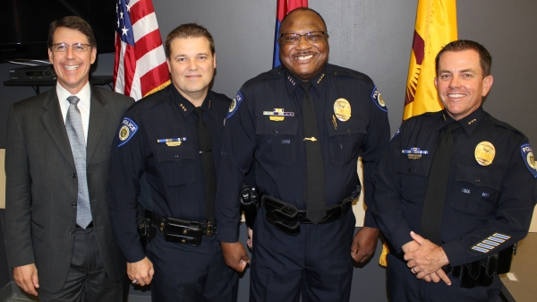 Four men pose for the camera. 