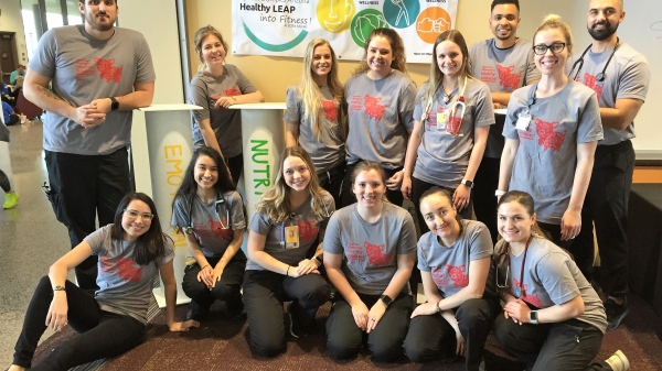 ASU nursing students pose for a group photo while volunteering at a health fair for Special Olympics of Arizona