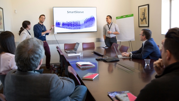 Students present a product pitch to a panel of judges