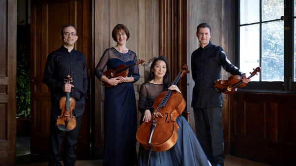 Brentano-String-Quartet posing with their instruments.