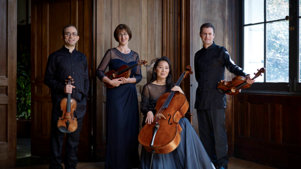 Brentano-String-Quartet posing with their instruments.