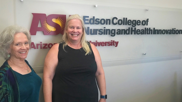 Bunny Kastenbaum stands with Mari Poledna in front of an ASU Edson College of Nursing and Health Innovation sign