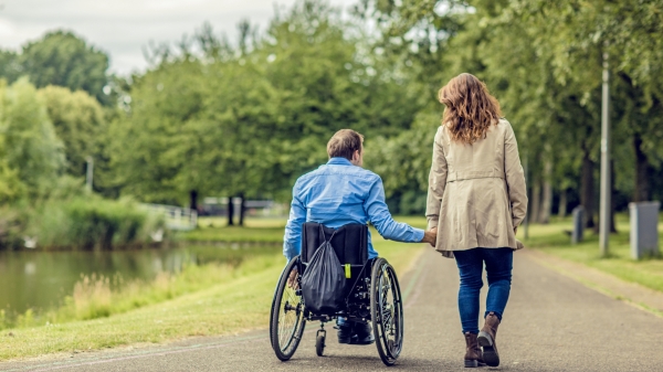 Two people holding hands