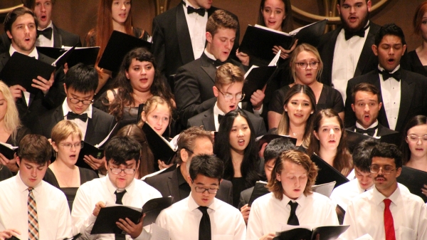 Students singing in a choir.