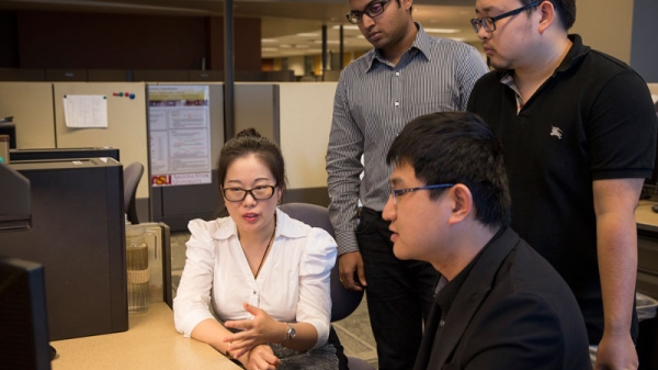 Jingrui He and her graduate students discuss their research on the interaction of varied data types