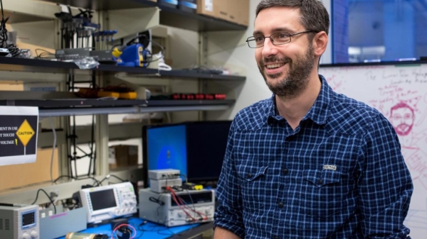 A spacecraft designer is interviewed in his lab