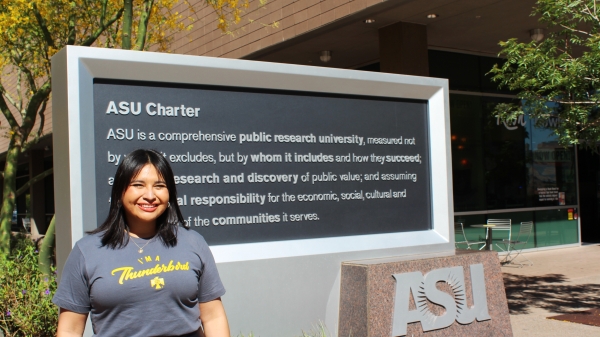 Dina De Leon poses in front of the ASU charter