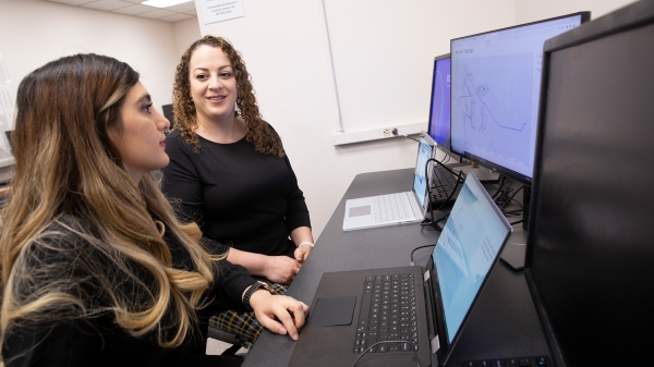 Electrical engineering doctoral student Zahra Soltani and Assistant Professor of electrical engineering Mojdeh Khorsand Hedman together in a computer lab.