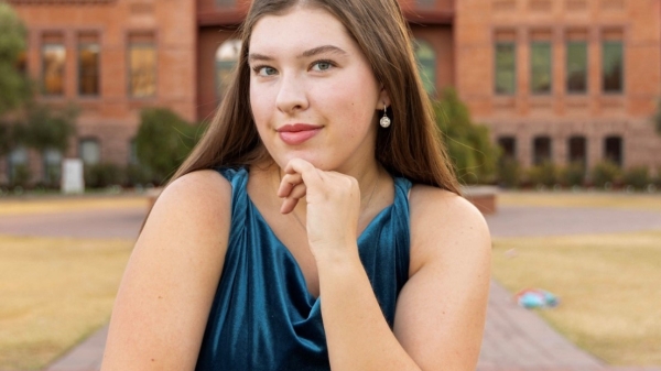 Portrait of Ellie Smith in front of Old Main at ASU Tempe campus.