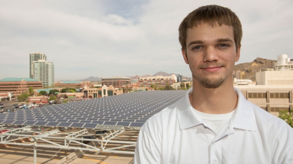 Nicholas Fortenberry overlooks solar energy modules at ASU