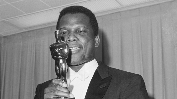 Sidney Poitier holding his Oscar