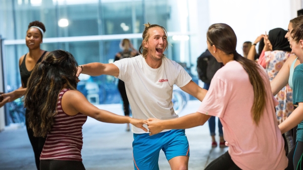 Students laugh during a Herberger Institute Day dance workshop