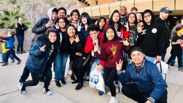 HOLA teens throw up their pitchforks for a group photo in front of Wells Fargo Arena