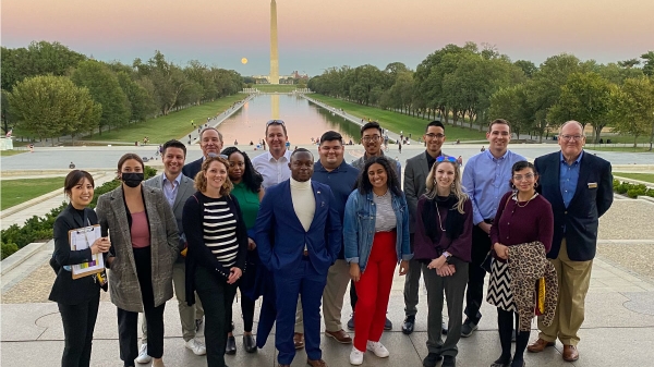 ASU Online Master of Arts International Affairs and Leadership students stand together with the Washington Monument in the background.