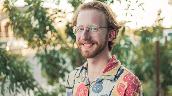 Portrait of student with red hair and beard and glasses