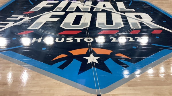 Floor of basketball court with Final Four 2023 logo on it