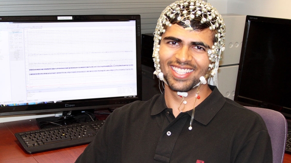 student wearing EEG cap