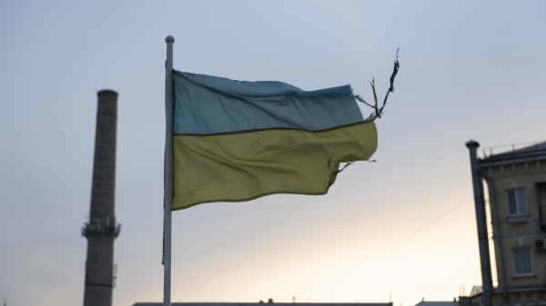 A weathered Ukrainian flag flying in Kyiv.