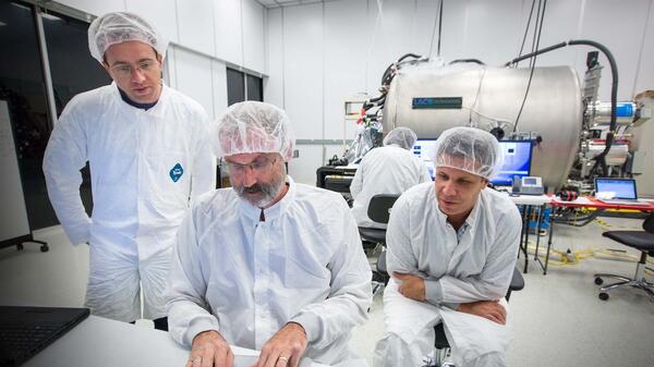 Scientists working in a cleanroom. 