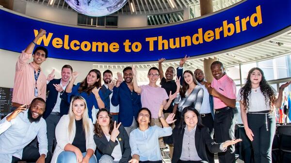 Group of students pose for a photo at Thunderbird School of Global Management during Foundations, Thunderbird's new student orientation.