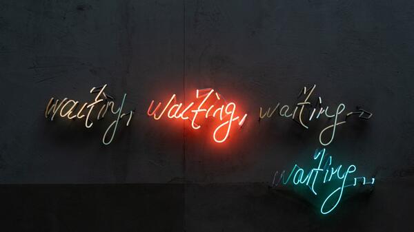 Abstract stock photo featuring the word "waiting" in various colors.