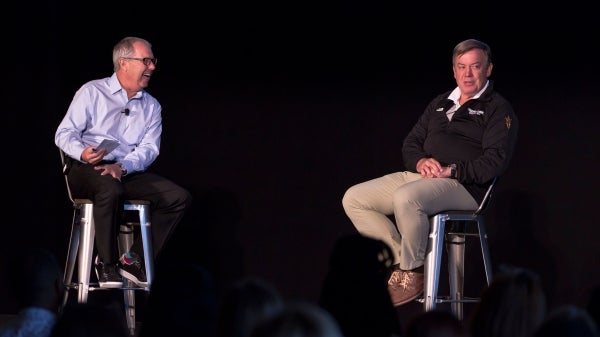 Mark King and Michael Crow speak onstage