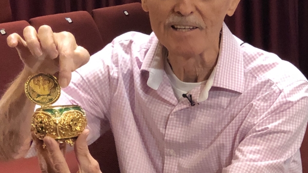 Animator Don Bluth poses with an egg he received during the production of Anastasia