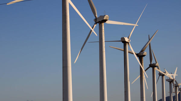 Windmills against a blue sky