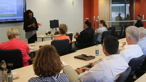 Dr. Raina MacIntyre speaks before an audience of public health professionals, researchers and first responders.