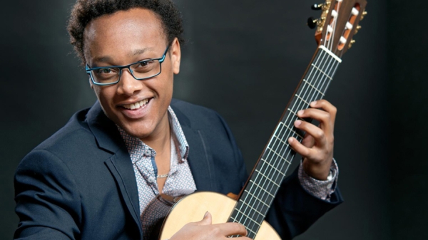 Raphael Feuillatre playing the guitar