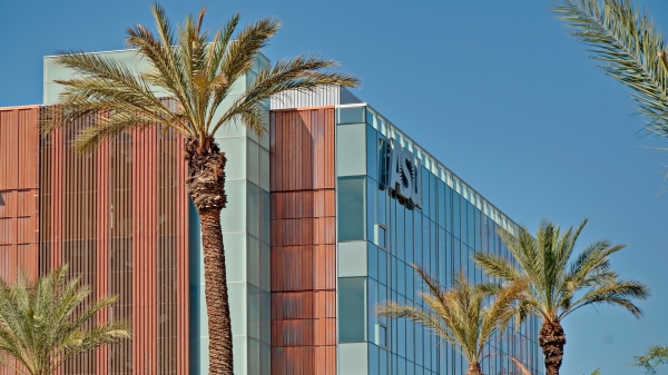 ASU's Health North Building with palm trees in the foreground and blue sky in the background