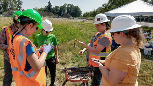 Researchers in field doing geotechnical earthquake engineering project