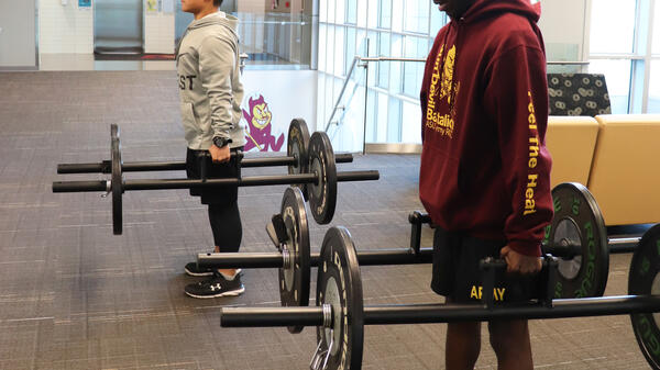 ASU ROTC students lifting weights.