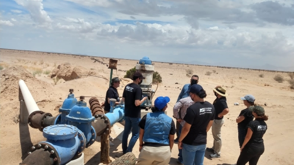 TEAM students examine ground water supply well in desert