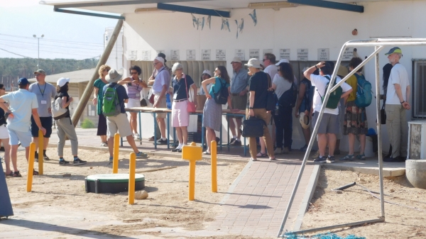 group of people touring a kibbutz