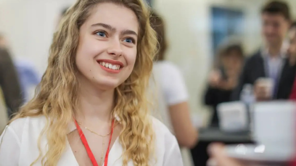 Student from American University Kyiv (AUK) engages at networking event.