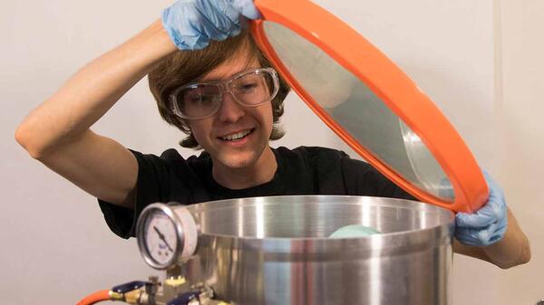 Team member John Patterson examines one of two sterilization systems invented by the ASU Luminosity Lab. Photo courtesy John Patterson