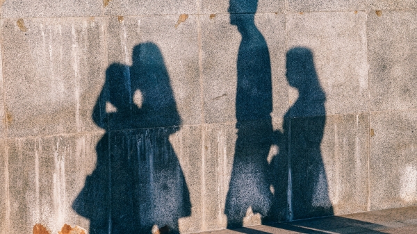 photo of people's shadows on wall
