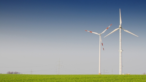 Windmills on a grass meadow